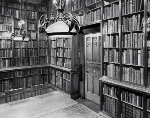 The Early Printed Books Room at the Rylands, showing the glass fronted bookcases, pendent light fittings and switches. Image provided by and © of The John Rylands Research Institute and Library, The University of Manchester